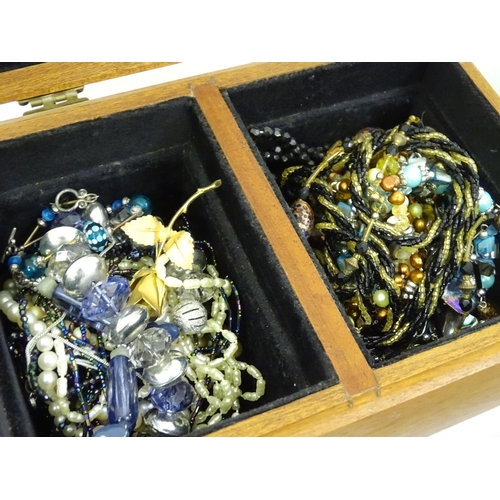 575 - A quantity of assorted costume jewellery to include brooches, necklaces etc to include examples by M... 