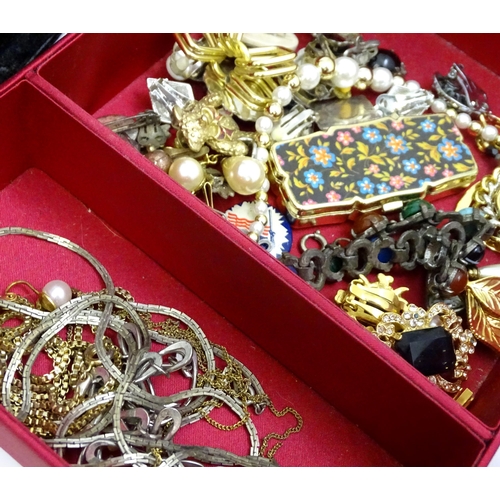 575 - A quantity of assorted costume jewellery to include brooches, necklaces etc to include examples by M... 