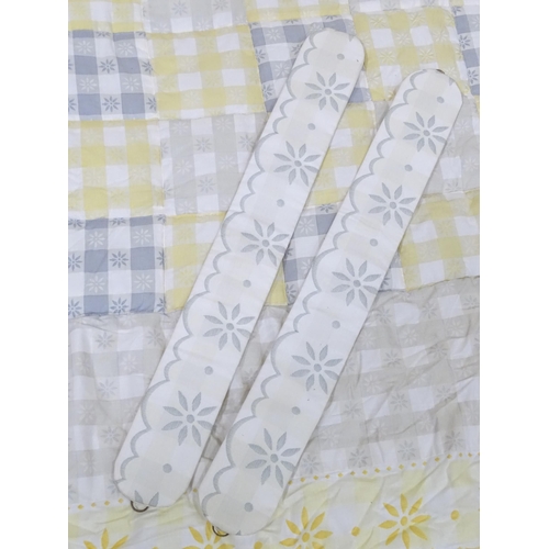 596 - A pair of curtains decorated in a yellow and white check pattern with bow detail. Together with a ma... 