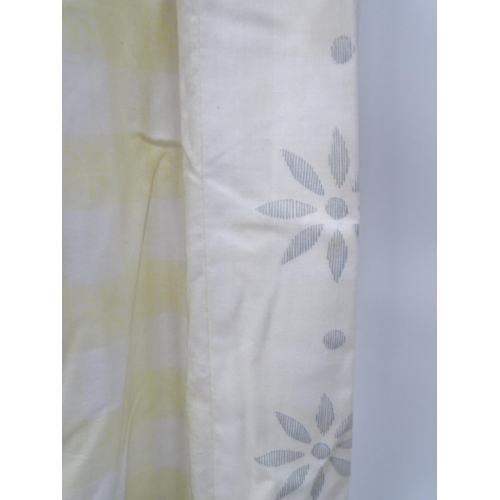 596 - A pair of curtains decorated in a yellow and white check pattern with bow detail. Together with a ma... 