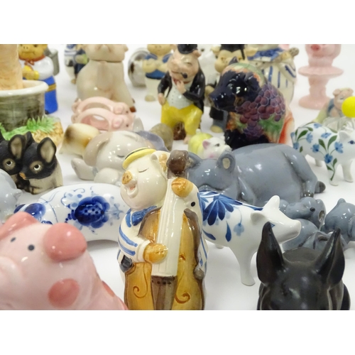 628 - A large quantity of assorted ceramic models of pigs to include examples by Nao, Border Fine Arts, Ro... 