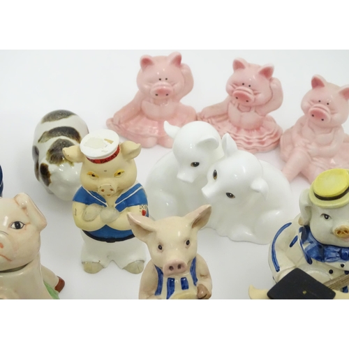 628 - A large quantity of assorted ceramic models of pigs to include examples by Nao, Border Fine Arts, Ro... 