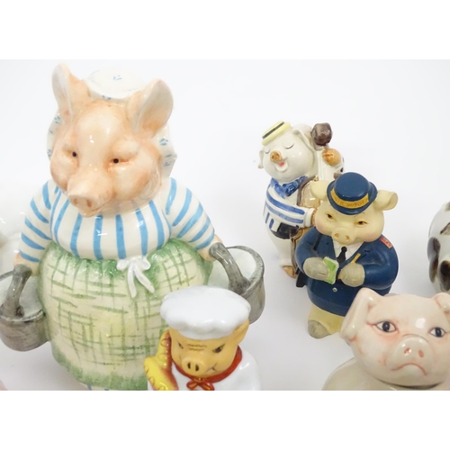 628 - A large quantity of assorted ceramic models of pigs to include examples by Nao, Border Fine Arts, Ro... 