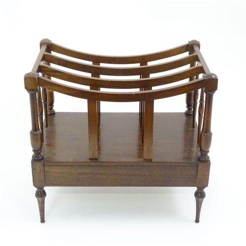 629 - A late 20thC mahogany Canterbury magazine rack together with an upholstered footstool, the largest a... 