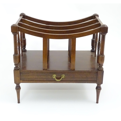 629 - A late 20thC mahogany Canterbury magazine rack together with an upholstered footstool, the largest a... 