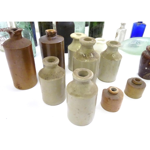 641 - A quantity of assorted glass and stoneware bottles to include codd bottles, beer bottles, milk bottl... 