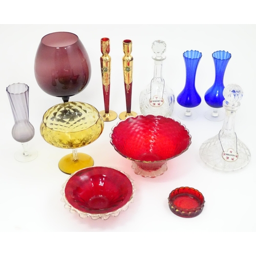 642 - A quantity of assorted glassware to include pedestal blue glass vases, candlesticks, decanters, pede... 