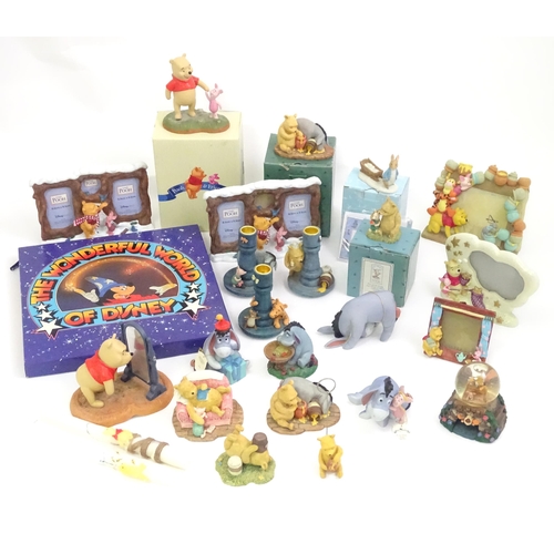 670 - A quantity of Winnie the Pooh figures / models to include examples by Border Fine Arts, Disney, etc.... 