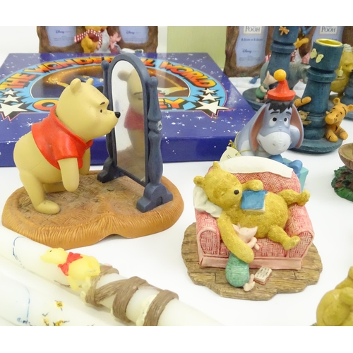 670 - A quantity of Winnie the Pooh figures / models to include examples by Border Fine Arts, Disney, etc.... 