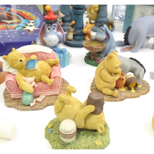 670 - A quantity of Winnie the Pooh figures / models to include examples by Border Fine Arts, Disney, etc.... 