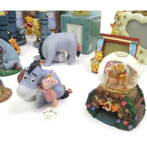 670 - A quantity of Winnie the Pooh figures / models to include examples by Border Fine Arts, Disney, etc.... 