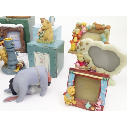 670 - A quantity of Winnie the Pooh figures / models to include examples by Border Fine Arts, Disney, etc.... 