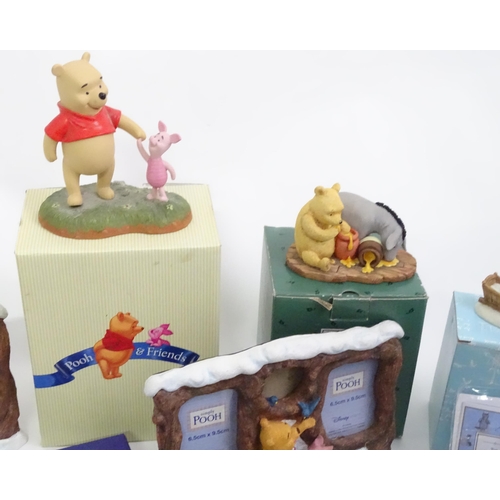 670 - A quantity of Winnie the Pooh figures / models to include examples by Border Fine Arts, Disney, etc.... 