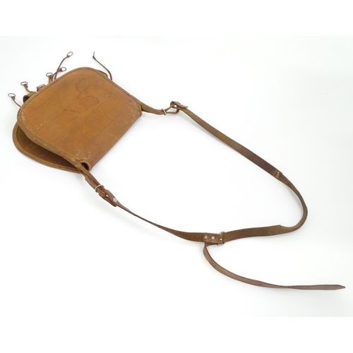 680 - A 20thC leather cartridge bag