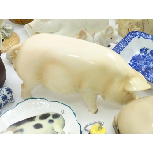 716 - A large quantity of kitchenalia with pig decoration to include butter dish, Sylvac dripping pots, An... 