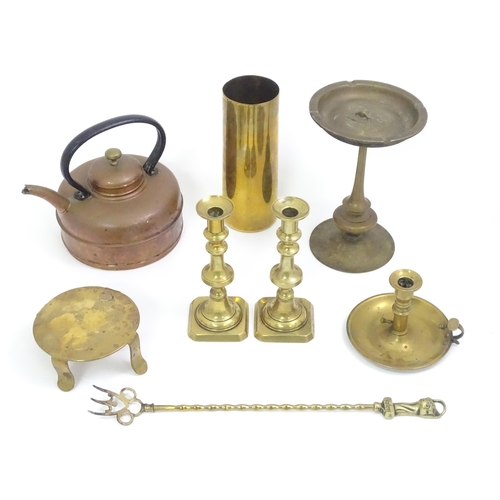 768 - A quantity of assorted brassware to include candlesticks, chamberstick, trenchart vase, bread toasti... 