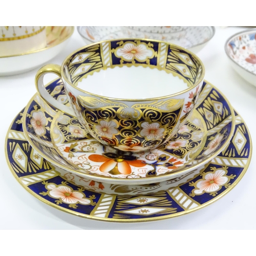 857 - A quantity of assorted 19thC and later tea / coffee wares to include tea / coffee cups, saucers, dis... 