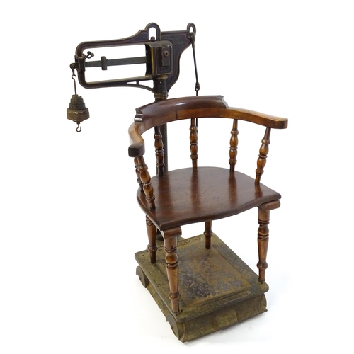 597 - A late 19thC W.T. Avery Pattern No. 139 cast iron platform weighing scale with jockey weighing chair... 