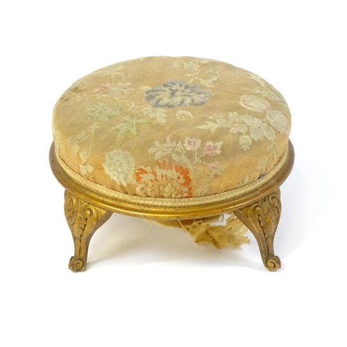 151 - An early 20thC circular footstool raised on four acanthus carved cabriole legs. 12