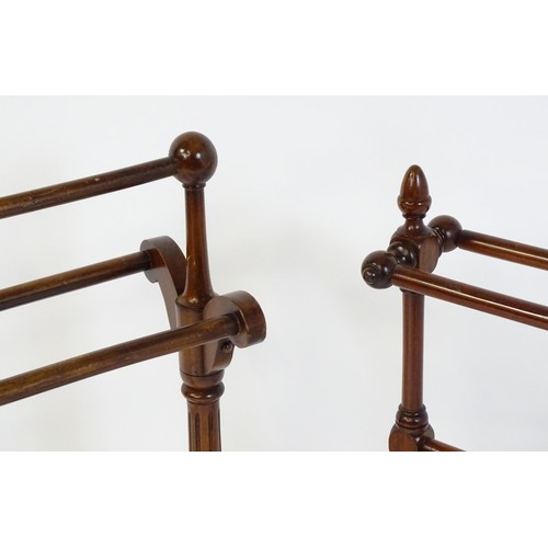 252 - Two 20thC mahogany towel rails. The largest measuring 27