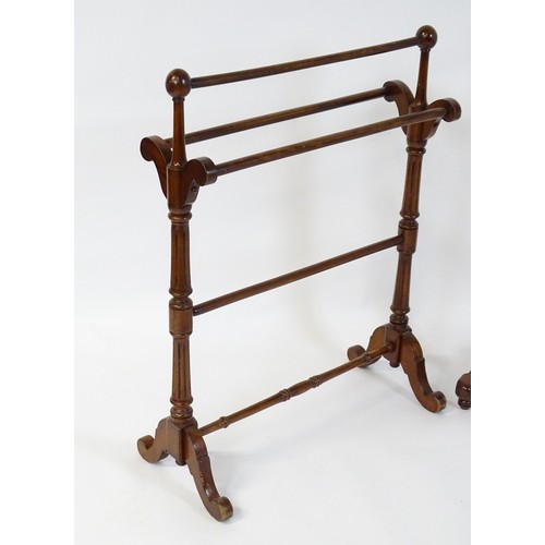 252 - Two 20thC mahogany towel rails. The largest measuring 27