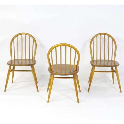 253 - Three elm and beech stick back Windsor chairs in the manner of Ercol. 17