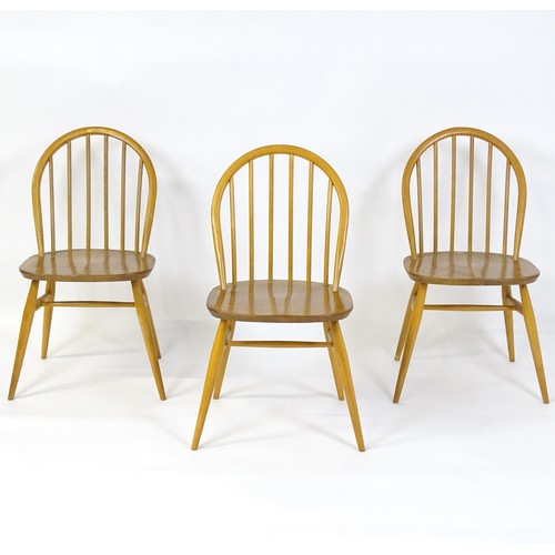 253 - Three elm and beech stick back Windsor chairs in the manner of Ercol. 17