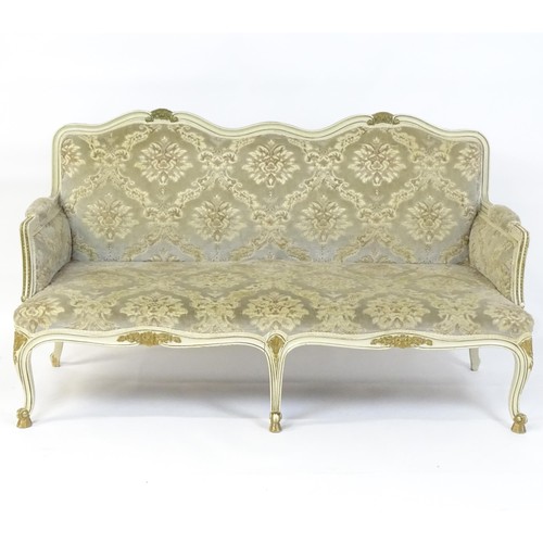 254 - A 20thC Louis XV style sofa with carved flower and shell decoration raised on five cabriole legs. 61... 