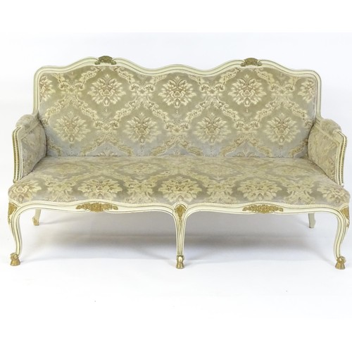 254 - A 20thC Louis XV style sofa with carved flower and shell decoration raised on five cabriole legs. 61... 