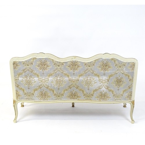 254 - A 20thC Louis XV style sofa with carved flower and shell decoration raised on five cabriole legs. 61... 