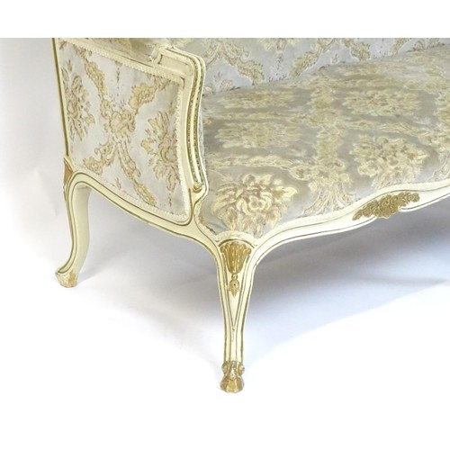 254 - A 20thC Louis XV style sofa with carved flower and shell decoration raised on five cabriole legs. 61... 