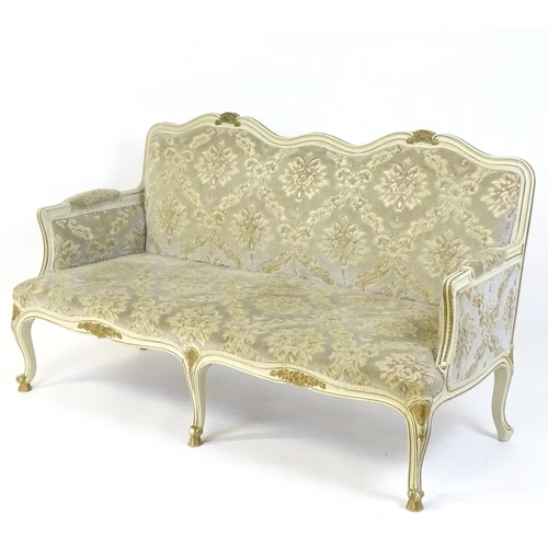 254 - A 20thC Louis XV style sofa with carved flower and shell decoration raised on five cabriole legs. 61... 