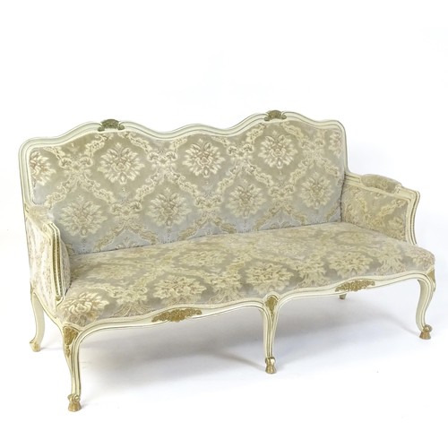 254 - A 20thC Louis XV style sofa with carved flower and shell decoration raised on five cabriole legs. 61... 