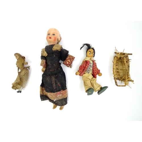 114 - Three assorted dolls to include a wooden example with painted features, one with a composite head an... 