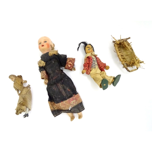 114 - Three assorted dolls to include a wooden example with painted features, one with a composite head an... 