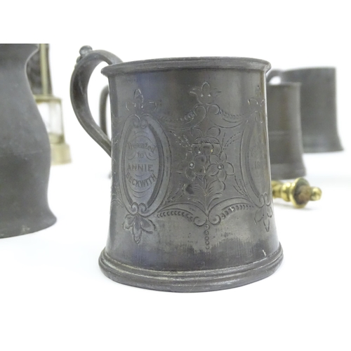 449 - A quantity of metalware, comprising pewter and brass tankards, a heavy horse terrett and miners lamp... 