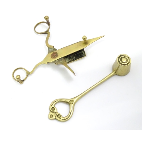 54 - A quantity of brassware to include candlesticks, wick snips, etc.