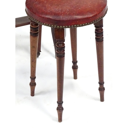 585 - An early 20thC mahogany drop flap / Sutherland table with canted corners, together with a 19thC leat... 