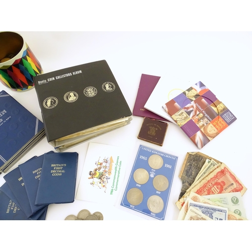 601 - Coins : a quantity of coinage and banknotes, to include five decimal sets, a cased 1965-1981 crown s... 