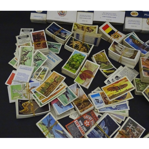 830 - A quantity of cigarette and tea cards to include examples from Brooke Bond series Adventurers & Expl... 