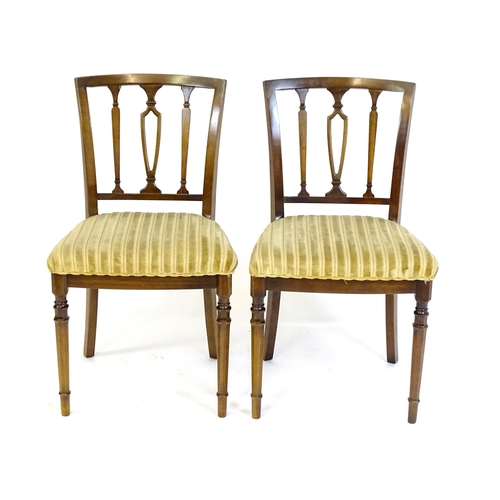 190 - A set of eight modern dining chairs with pierced back splats and raised on canted tapering front leg... 