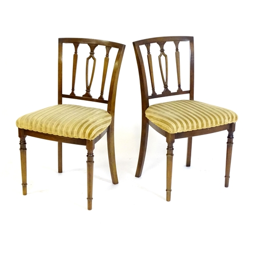 190 - A set of eight modern dining chairs with pierced back splats and raised on canted tapering front leg... 