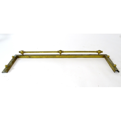 887 - A brass fire fender, with stepped base and ball supports, approx 53 1/2