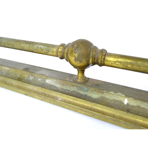 887 - A brass fire fender, with stepped base and ball supports, approx 53 1/2