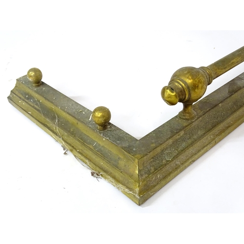 887 - A brass fire fender, with stepped base and ball supports, approx 53 1/2