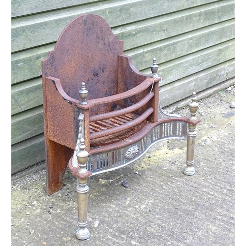 920 - A mid 20thC cast iron and brass fire basket, approx 24