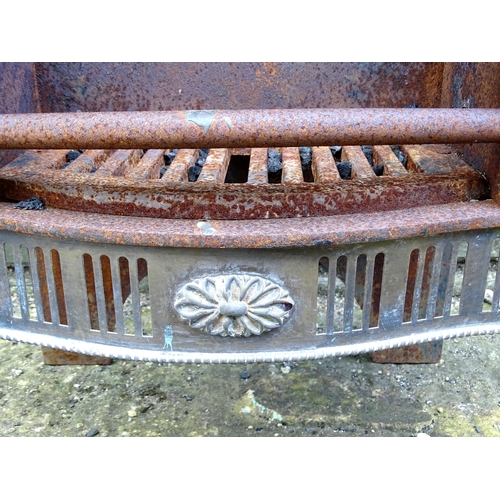 920 - A mid 20thC cast iron and brass fire basket, approx 24