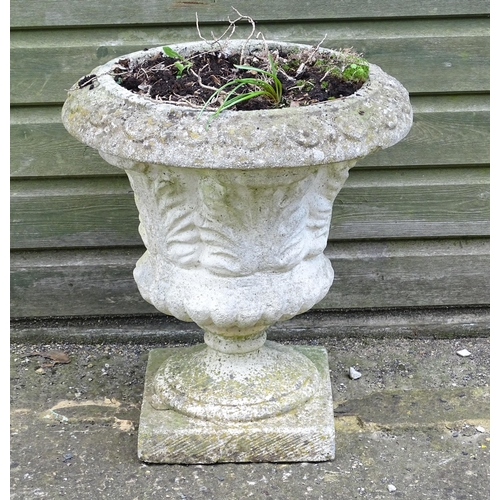 921 - A reconstituted stone planter of classical urn form, standing approx 20