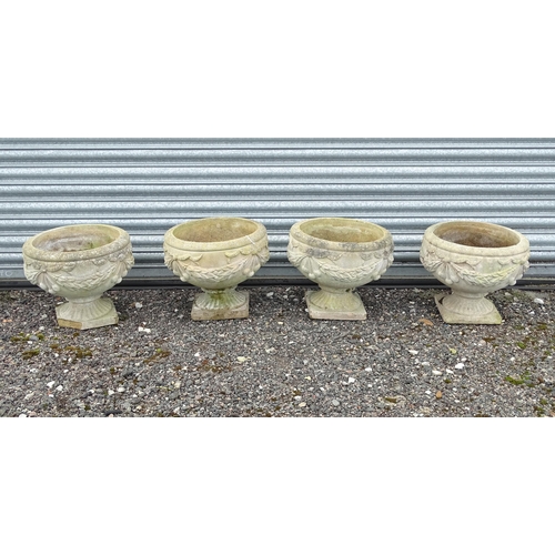 922 - Four matching reconstituted stone pedestal planters with bow and swag detail, each approx 13