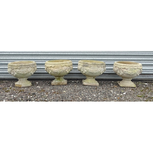 922 - Four matching reconstituted stone pedestal planters with bow and swag detail, each approx 13